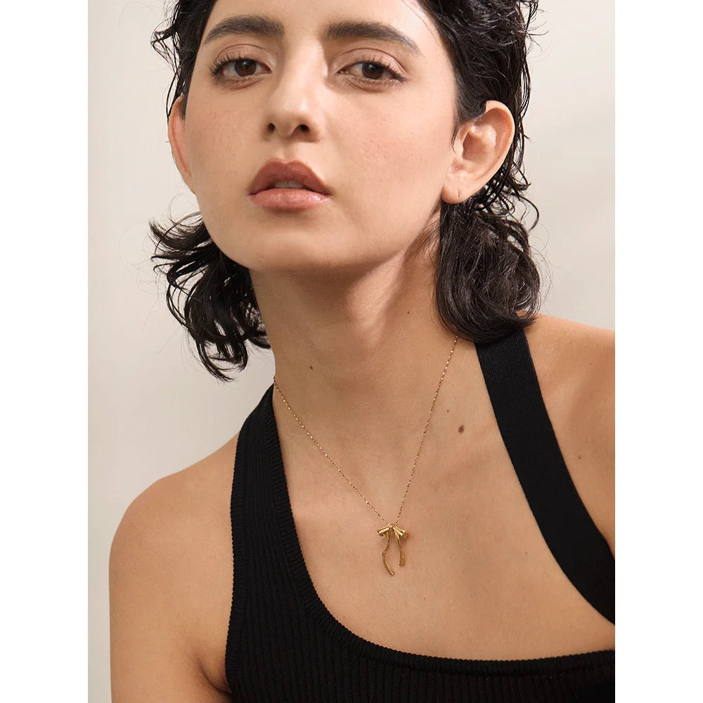 Cecile Bow Pendant, waterproof necklace in 316L stainless steel with a gold or silver-tone PVD finish by Lark & Reed, view 4