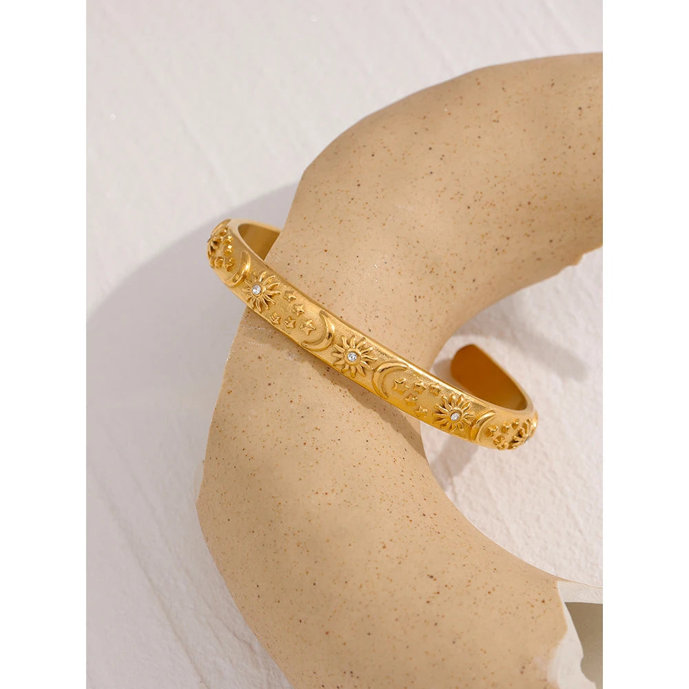 Celestia Engraved Cuff, waterproof bracelet in 316L stainless steel with a gold PVD finish by Lark & Reed, view 2