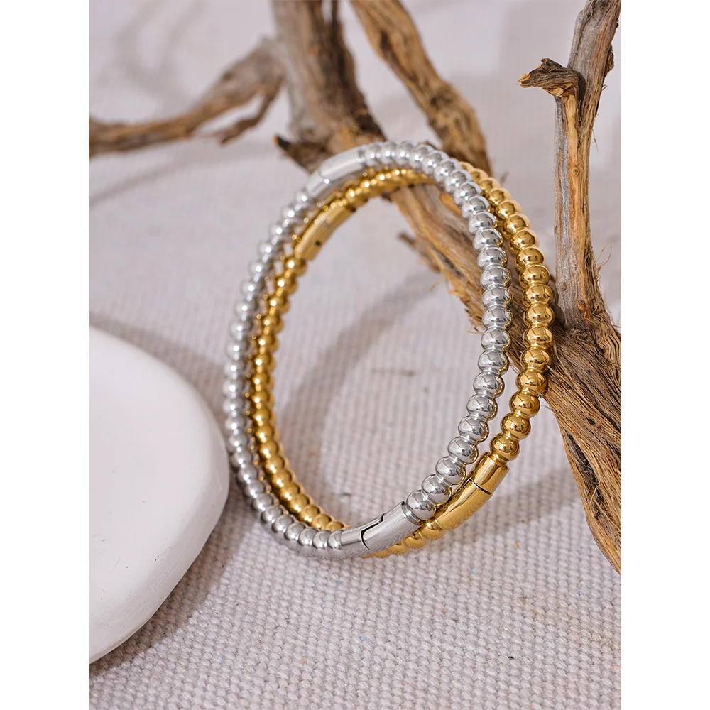 Kalmar Twisted Bangle, waterproof bracelet in 316L stainless steel with a gold or silver-tone PVD finish by Lark & Reed, view 5
