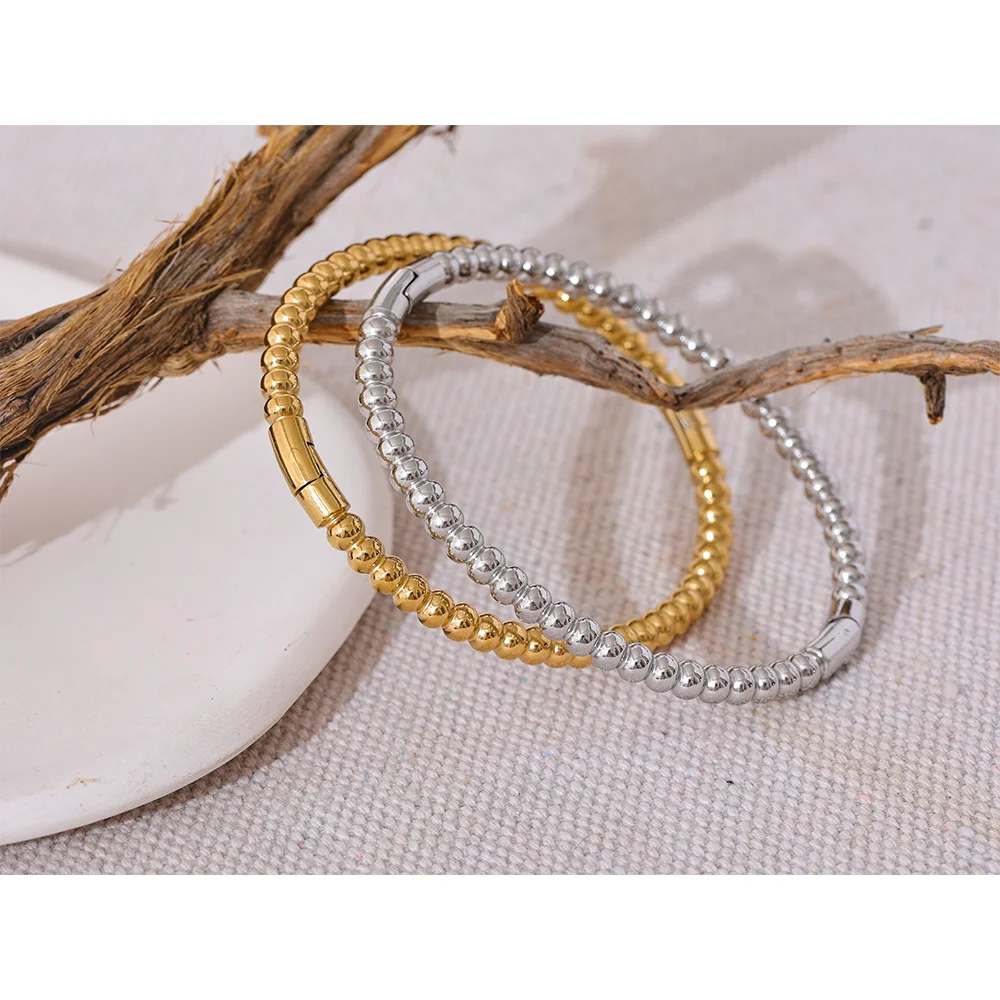 Kalmar Twisted Bangle, waterproof bracelet in 316L stainless steel with a gold or silver-tone PVD finish by Lark & Reed, view 3
