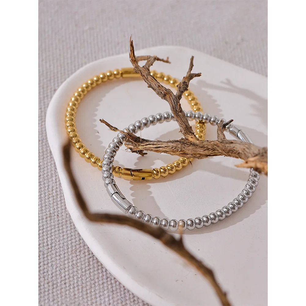 Kalmar Twisted Bangle, waterproof bracelet in 316L stainless steel with a gold or silver-tone PVD finish by Lark & Reed, view 4