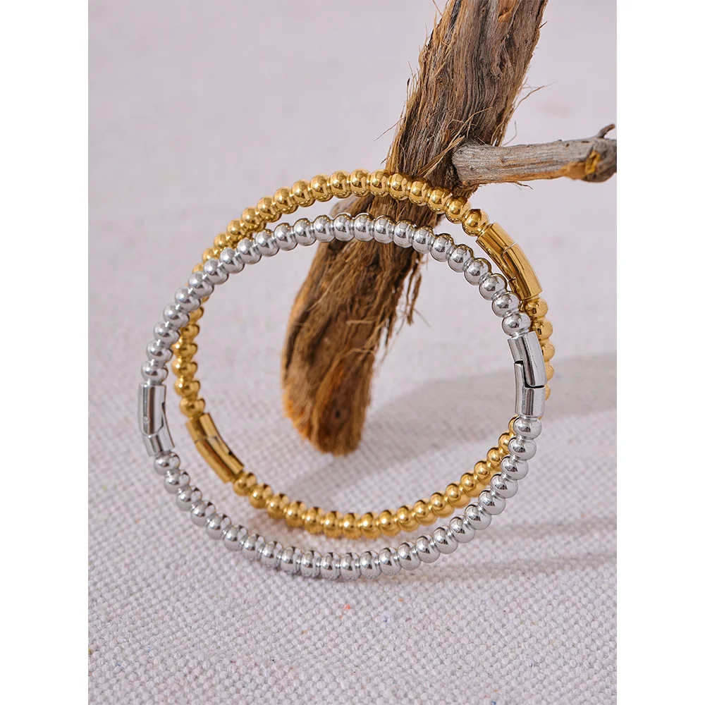 Kalmar Twisted Bangle, waterproof bracelet in 316L stainless steel with a gold or silver-tone PVD finish by Lark & Reed, view 6