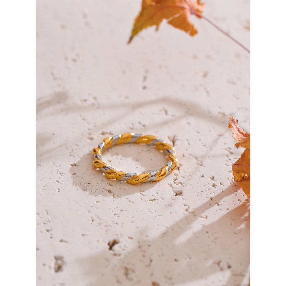 Vilja Two-Tone Twist Ring, waterproof ring in 316L stainless steel with a gold PVD finish by Lark & Reed, view 4