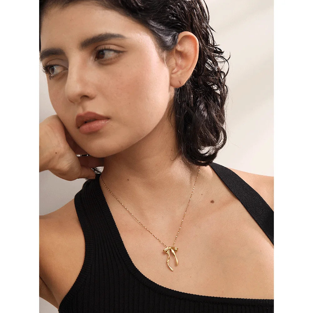 Cecile Bow Pendant, waterproof necklace in 316L stainless steel with a gold or silver-tone PVD finish by Lark & Reed, view 2