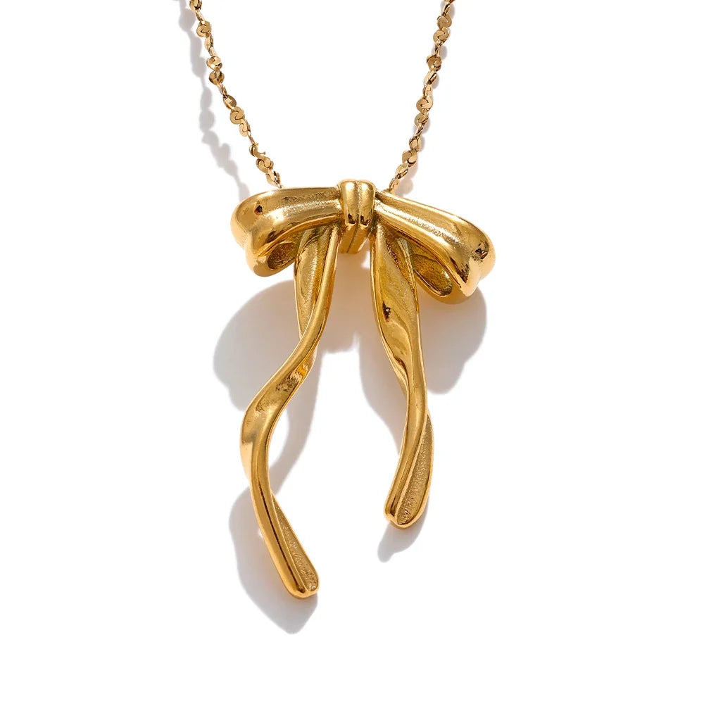 Cecile Bow Pendant, waterproof necklace in 316L stainless steel with a gold or silver-tone PVD finish by Lark & Reed