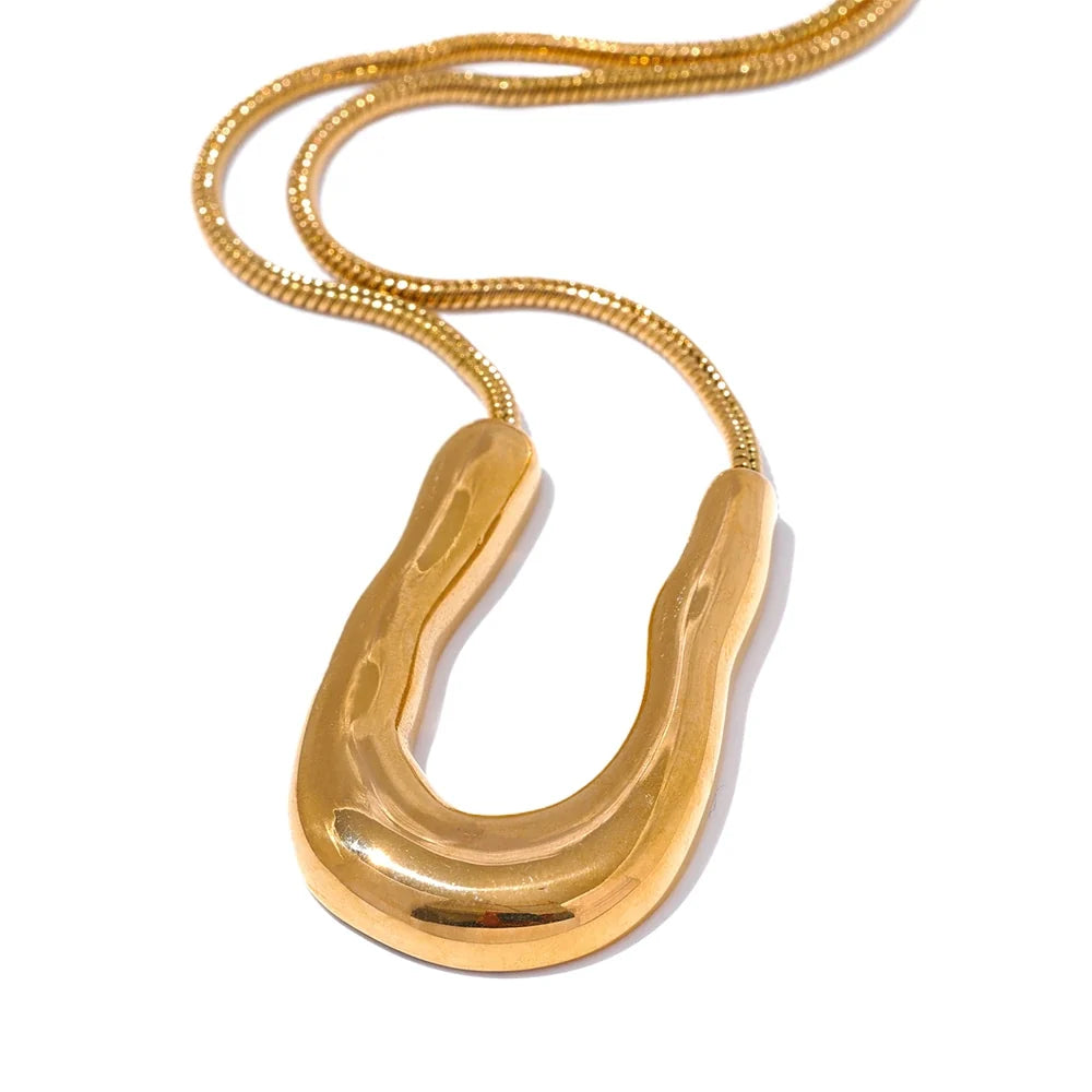 Hedda Sculpted U Pendant, waterproof necklace in 316L stainless steel with a gold or silver-tone PVD finish by Lark & Reed