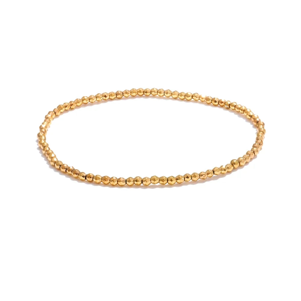 Nazare smal snoet armring, armbånd, tåler vand, rustfrit stål 316L med guldfarvet PVD-belægning, Lark & Reed