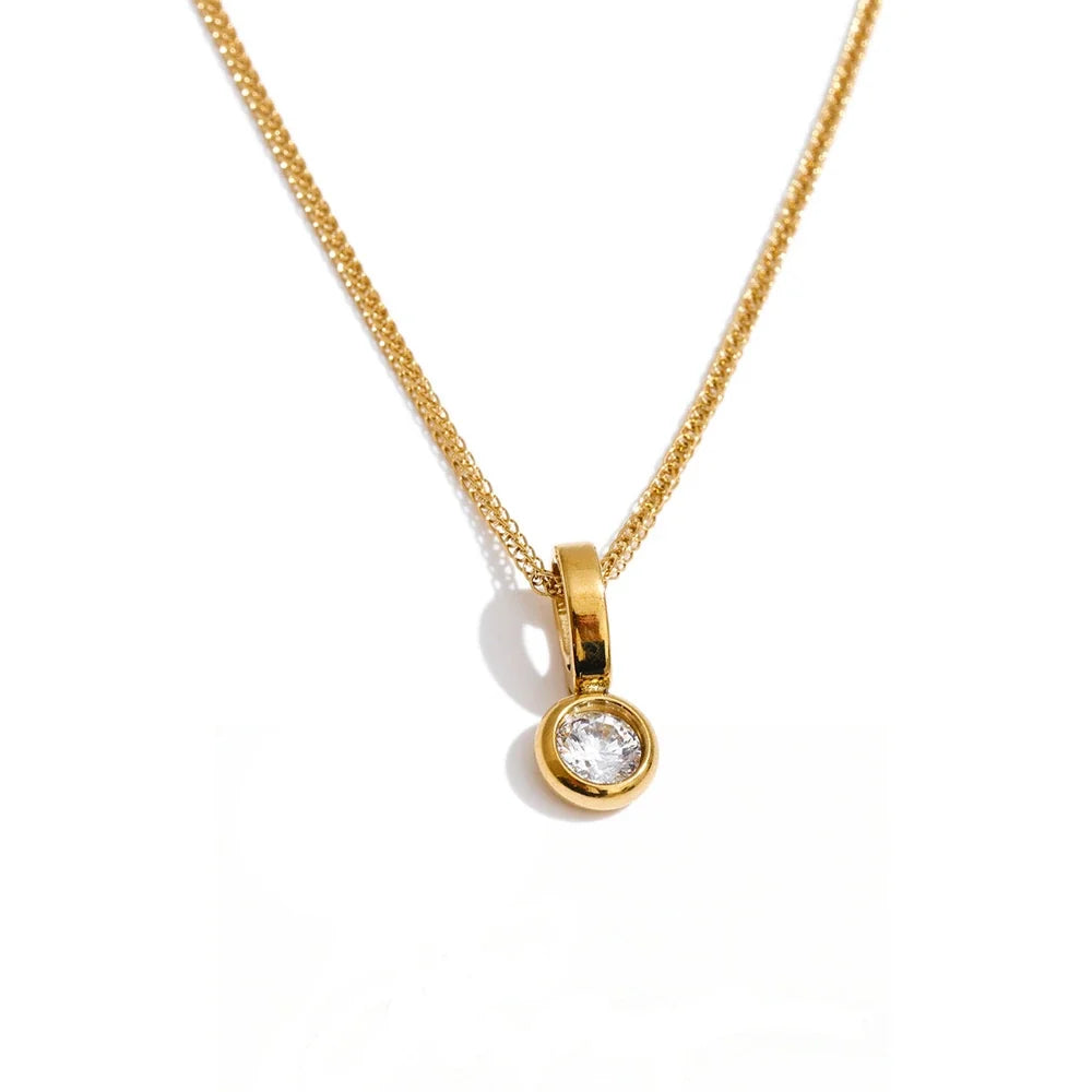 Tilde Bezel Crystal Pendant, waterproof necklace in 316L stainless steel with a gold or silver-tone PVD finish by Lark & Reed