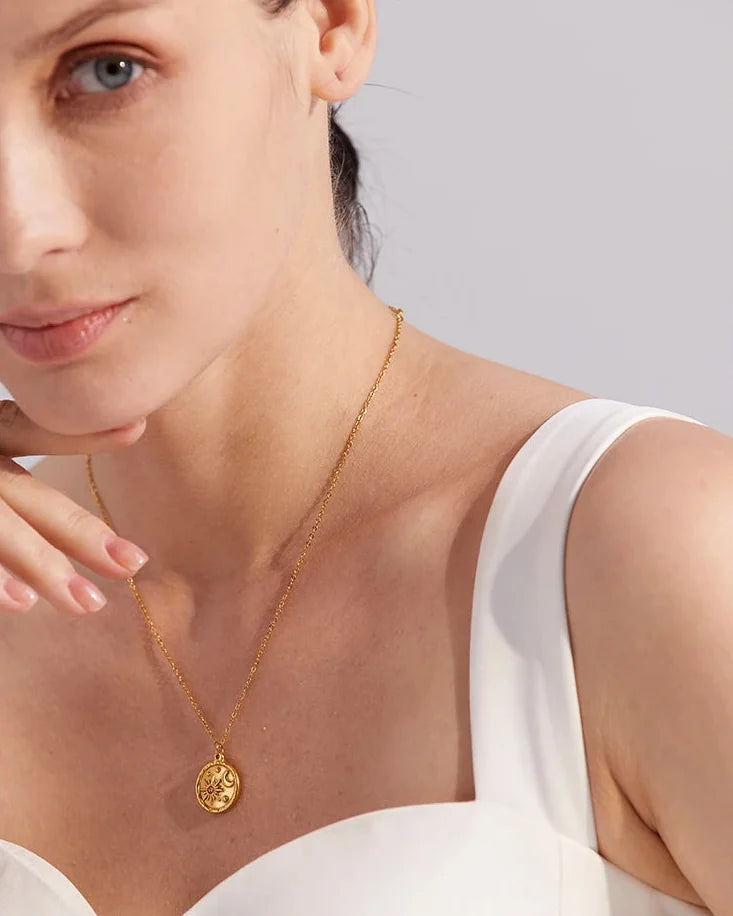 Model wearing a moon pendant necklace