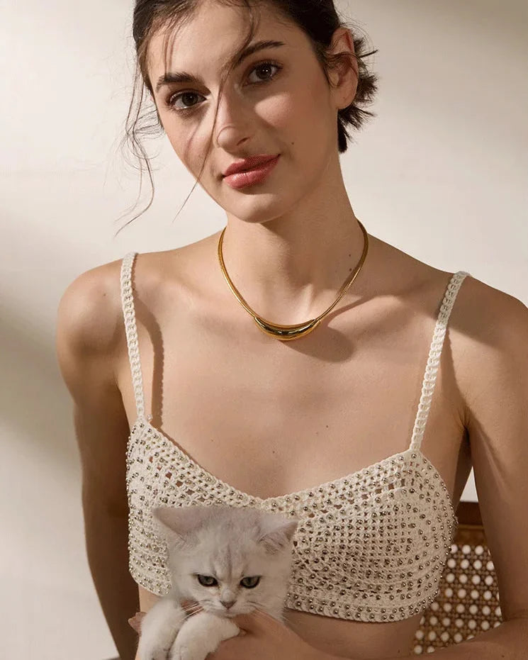 Model wearing a gold choker
